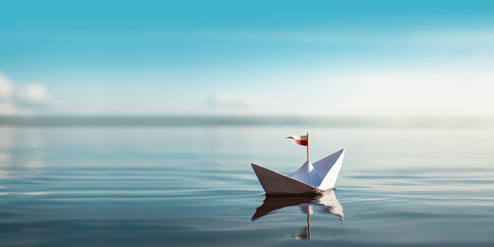 Sail boat_980x490 Paper sail boat on open water
