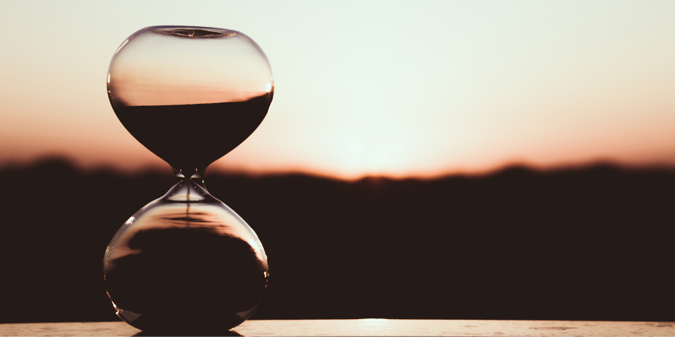 Time_980x490 Hour glass at sunset
