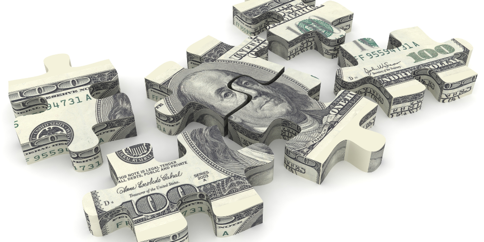 Money puzzle pieces of a hundred dollar bill