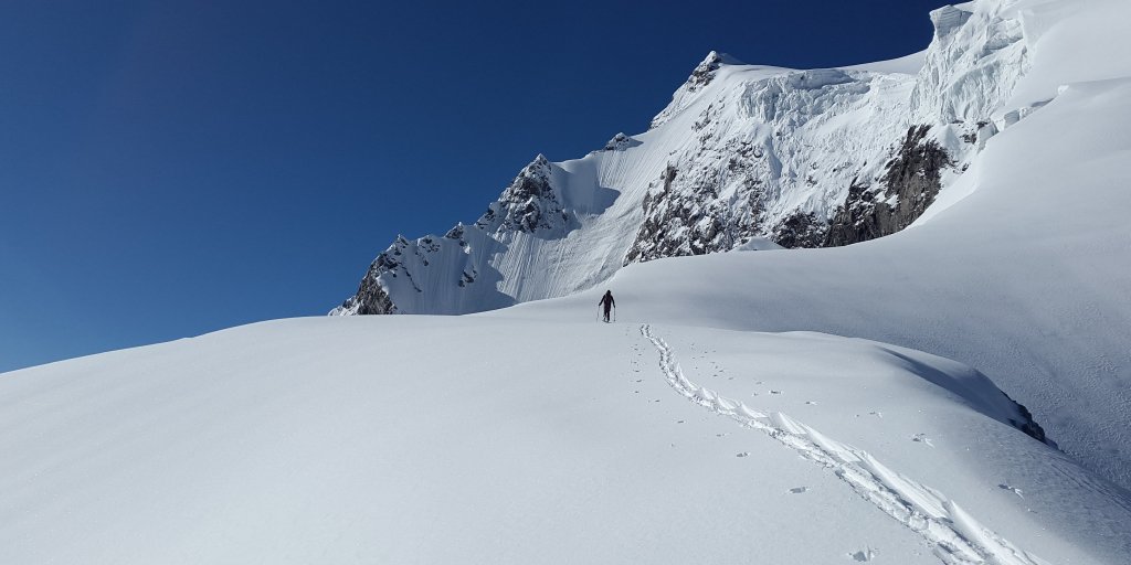 man climbing up in snow